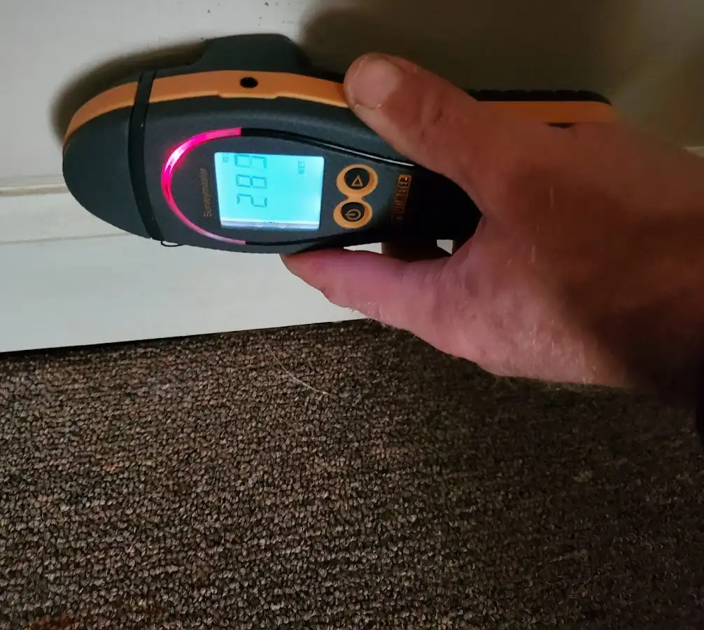 Moisture detection at baseboard during Storm Damage Restoration in Harwinton